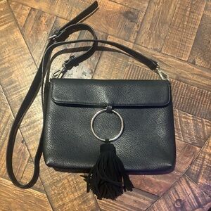 Anthropologie Street Level  Black Faux Leather Crossbody Bag with Tassel Detail.
